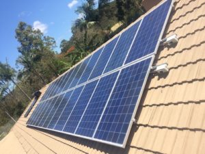 Solar Panels on a Clean Beige Roof — Solar Power Services in Brisbane, QLD